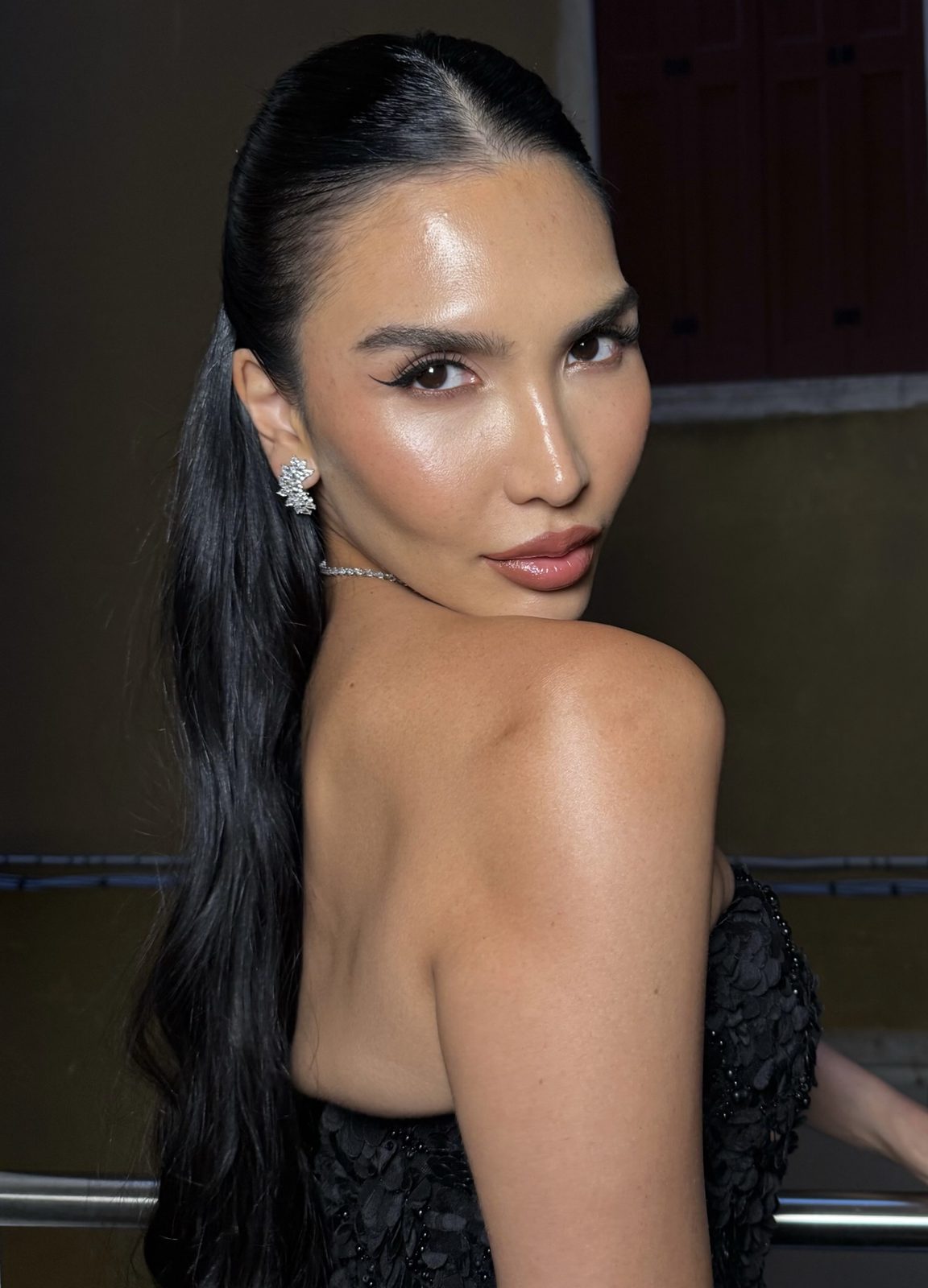 Actress Zarina Yeva, slicked-back glam with a black gown, Venice Film Festival 2025, hair and makeup by Andrada Rusu